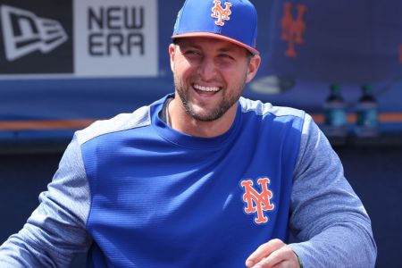 PORT ST. LUCIE, FL - MARCH 7: Tim Tebow #83 of the New York Mets looks on from the dugout at the start of the spring training game against the New York Yankees at First Date Field on March 7, 2018 in Port St. Lucie, Florida. (Photo by Joel Auerbach/Getty Images)