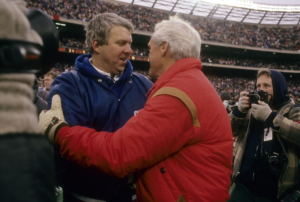NY Giants coach Bill Parcells (L) shakes hands with the 49ers' Bill Walsh back in the mid-1980s. (Focus on Sport/Getty Images)