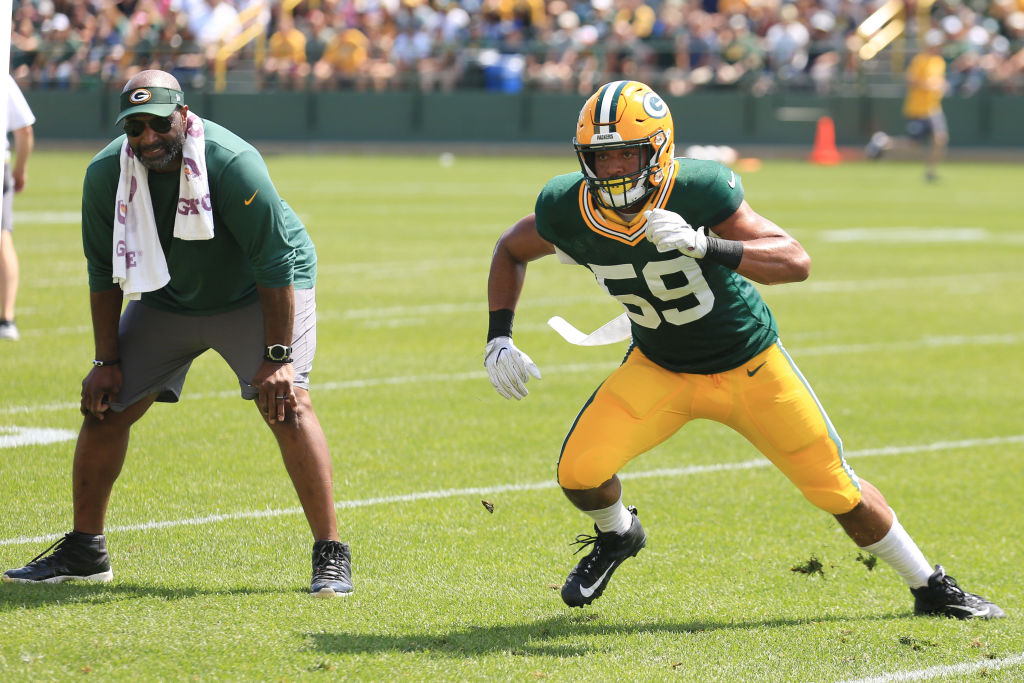 ASHWAUBENON, WI - JULY 30: Green Bay Packers linebacker Marcus Porter (59) runs in coverage while linebackers coach Winston Moss looks on during Green Bay Packers training camp at Ray Ntschke Field on July 30, 2018 in Ashwaubenon, WI. (Photo by Larry Radloff/Icon Sportswire via Getty Images)