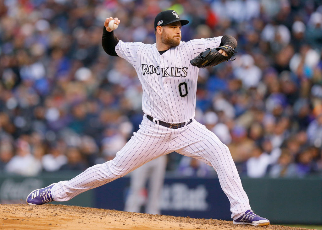 DENVER, CO - OCTOBER 07:  Adam Ottavino #0 of the Colorado Rockies pitches in the seventh inning of Game Three of the National League Division Series against the Milwaukee Brewers at Coors Field on October 7, 2018 in Denver, Colorado.  (Photo by Justin Edmonds/Getty Images)