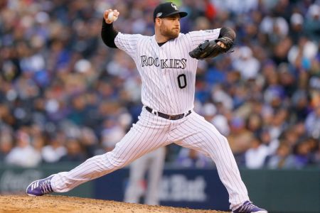 DENVER, CO - OCTOBER 07:  Adam Ottavino #0 of the Colorado Rockies pitches in the seventh inning of Game Three of the National League Division Series against the Milwaukee Brewers at Coors Field on October 7, 2018 in Denver, Colorado.  (Photo by Justin Edmonds/Getty Images)