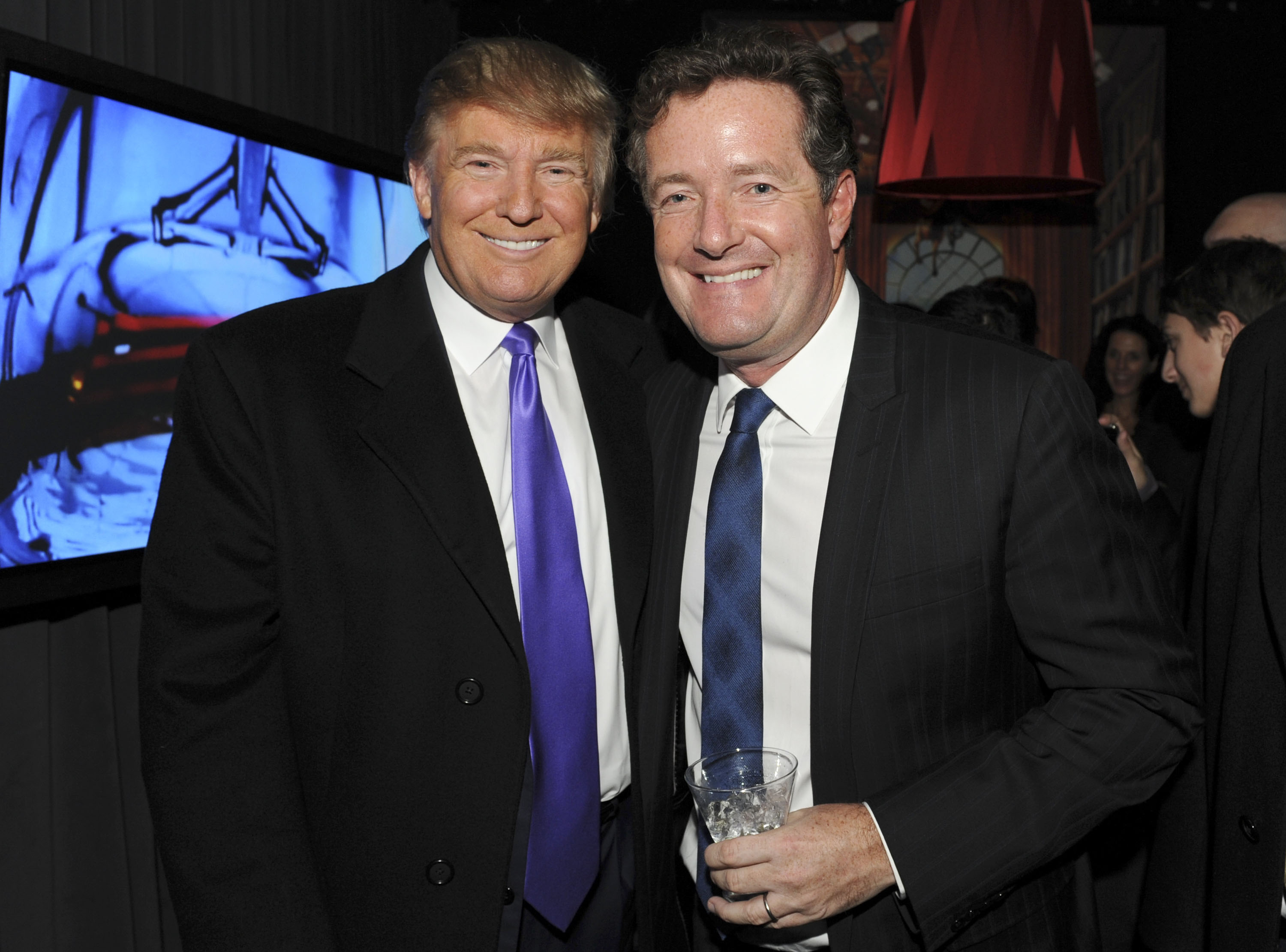 Then-television personality Donald Trump and Piers Morgan attend the celebration of Perfumania and Kim Kardashians appearance on NBCs "The Apprentice" at the Provocateur at The Hotel Gansevoort on November 10, 2010 in New York, New York. (Photo by Mathew Imaging/WireImage)