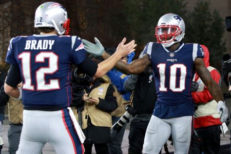 FOXBOROUGH, MA - DECEMBER 2: Patriots quarterback Tom Brady (left) congratulates Josh Gordon after his touchdown  in the third quarter. The New England Patriots play against the Minnesota Vikings at Gillette Stadium in Foxborough on Dec. 02, 2018. (Photo by Jim Davis/The Boston Globe via Getty Images)