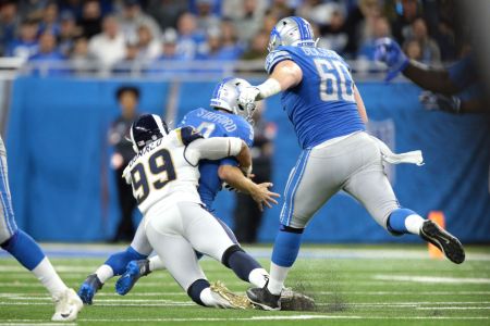 Detroit Lions quarterback Matthew Stafford (9) is tackled by Los Angeles Rams defensive tackle Aaron Donald (99) during the second half of an NFL football game in Detroit, Michigan USA, on Sunday, December 2,  2018. (Photo by Jorge Lemus/NurPhoto via Getty Images)