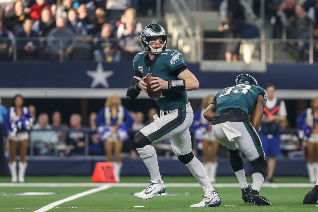 ARLINGTON, TX - DECEMBER 09: Philadelphia Eagles quarterback Carson Wentz (11) looks downfield for an open receiver during the game between the Dallas Cowboys and the Philadelphia Eagles on December 9, 2018 at AT&T Stadium in Arlington. Texas. (Photo by Matthew Pearce/Icon Sportswire via Getty Images)