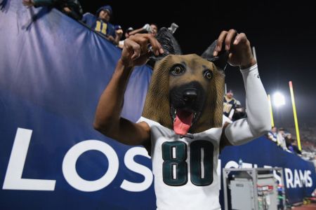 LOS ANGELES, CA - DECEMBER 16:  Jordan Matthews #80 of the Philadelphia Eagles holds up a dog mask recevied from a fan after a 30-23 win over the Los Angeles Rams at Los Angeles at Los Angeles Memorial Coliseum on December 16, 2018 in Los Angeles, California.  (Photo by Harry How/Getty Images)