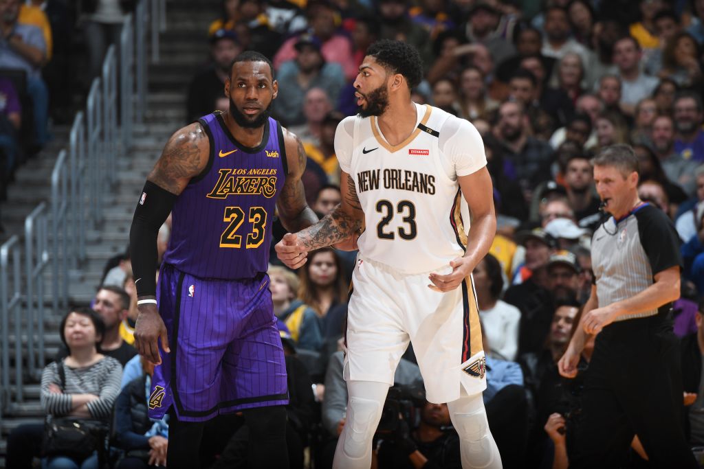 LeBron James #23 of the Los Angeles Lakers and Anthony Davis #23 of the New Orleans Pelicans fight for position during a game on December 21, 2018 at STAPLES Center in Los Angeles, California. (Photo by Andrew D. Bernstein/NBAE via Getty Images)