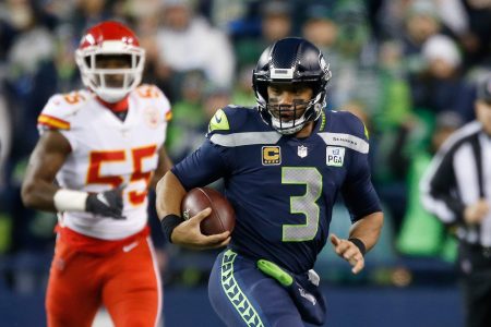 Quarterback Russell Wilson #3 of the Seattle Seahawks rushes for a first down during the first quarter of the game against the Kansas City Chiefs at CenturyLink Field on December 23, 2018 in Seattle, Washington.  (Photo by Otto Greule Jr/Getty Images)
