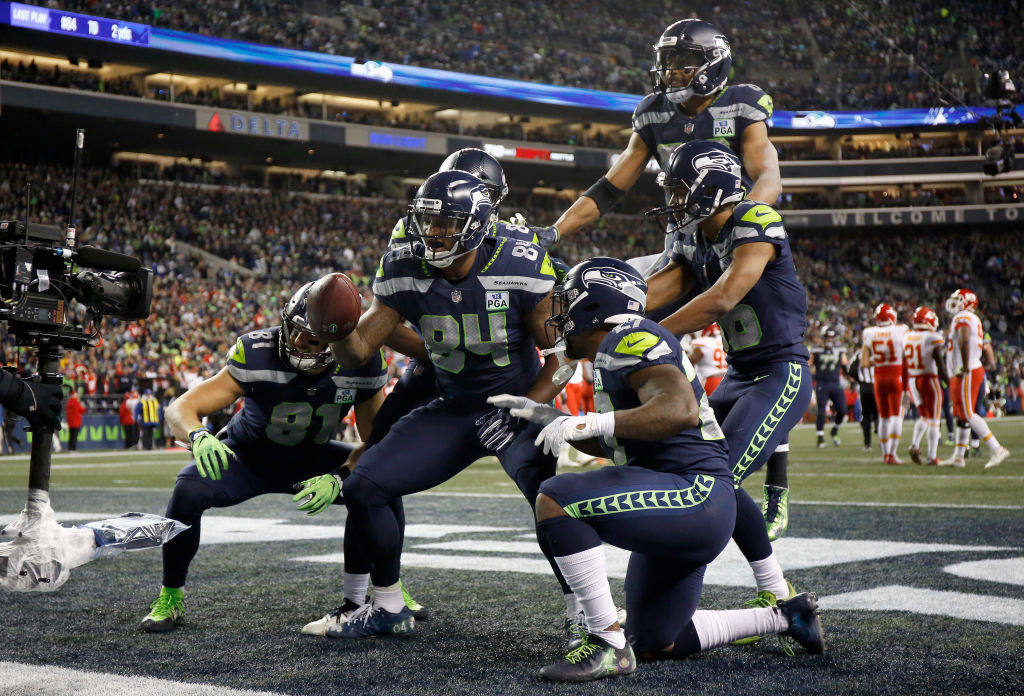 SEATTLE, WA - DECEMBER 23:  Ed Dickson #84 of the Seattle Seahawks poses with teammates after scoring a touchdown in the fourth quarter of the game against the Kansas City Chiefs at CenturyLink Field on December 23, 2018 in Seattle, Washington.  (Photo by Otto Greule Jr/Getty Images)