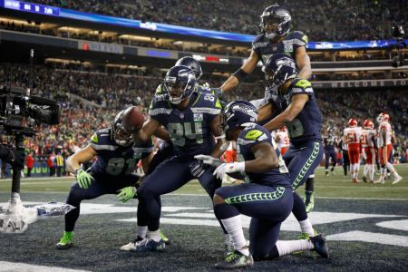 SEATTLE, WA - DECEMBER 23:  Ed Dickson #84 of the Seattle Seahawks poses with teammates after scoring a touchdown in the fourth quarter of the game against the Kansas City Chiefs at CenturyLink Field on December 23, 2018 in Seattle, Washington.  (Photo by Otto Greule Jr/Getty Images)