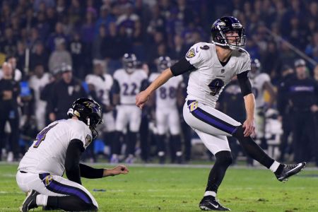 CARSON, CALIFORNIA - DECEMBER 22:   Justin Tucker #9 of the Baltimore Ravens watches his field goal with Sam Koch #4, to take a 3-0 lead over the Los Angeles Chargers, during the first quarter at StubHub Center on December 22, 2018 in Carson, California. (Photo by Harry How/Getty Images)
