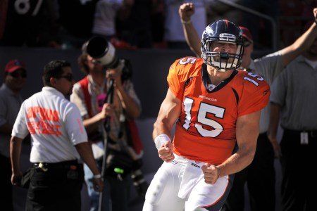 Denver Broncos quarterback Tim Tebow runs the ball in for a touchdown during the second quarter of play against New York Jets Sunday October 17, 2010 at Invesco Field at Mile High. Photo by Joe Amon, The Denver Post  (Photo By Joe Amon/The Denver Post via Getty Images)