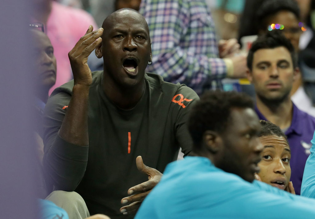 CHARLOTTE, NC - OCTOBER 13:  Michael Jordan, owner of the Charlotte Hornets reacts on the bench during their game against the Dallas Mavericks at Spectrum Center on October 13, 2017 in Charlotte, North Carolina. (Photo by Streeter Lecka/Getty Images)