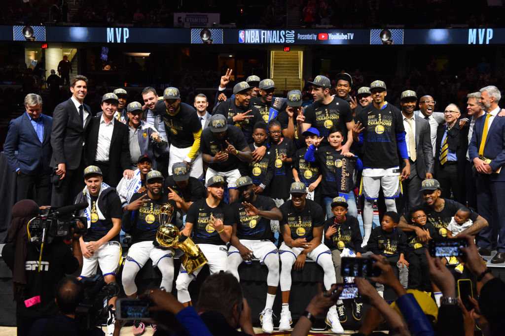 The Golden State Warriors team poses for a photo after defeating the Cleveland Cavaliers in Game Four of the 2018 NBA Finals to become the 2018 NBA Finals Champions on June 8, 2018 at Quicken Loans Arena in Cleveland, Ohio. (Photo by Jesse D. Garrabrant/NBAE via Getty Images)