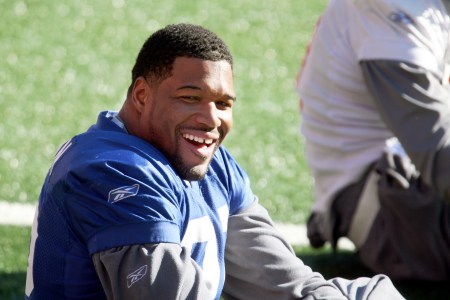 UNITED STATES - JANUARY 16:  New York Giants' defensive end Michael Strahan smiles as he stretches on the turf at Giants Stadium during a team practice in preparation for Sunday's NFC Championship Playoff game against the Green Bay Packers at Lambeau Field.  (Photo by Ron Antonelli/NY Daily News Archive via Getty Images)