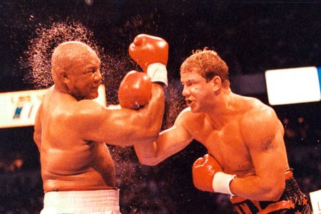 LAS VEGAS - JUNE 7, 1993: Tommy Morrison (R) connects with a right punch against George Foreman at the Thomas & Mack Center, on June 7,1993 in Las Vegas, Nevada. Tommy Morrison won by a UD 12 to claim a share of the heavyweight championship. (The Ring Magazine/Getty Images)