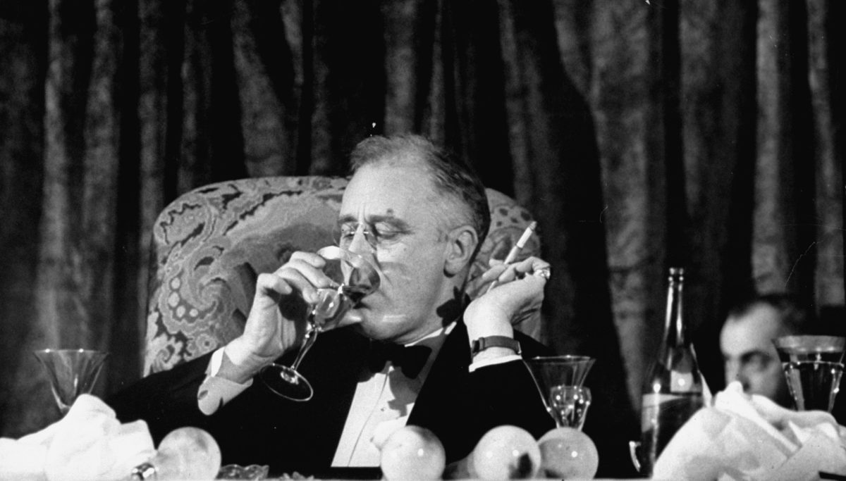 Pres. Franklin Roosevelt drinking white wine as he listens to Speaker Bankhead Jackson Day dinner speech during a Democratic fundraiser. FDR won four presidential elections. (Thomas D. Mcavoy/The LIFE Picture Collection/Getty Images)