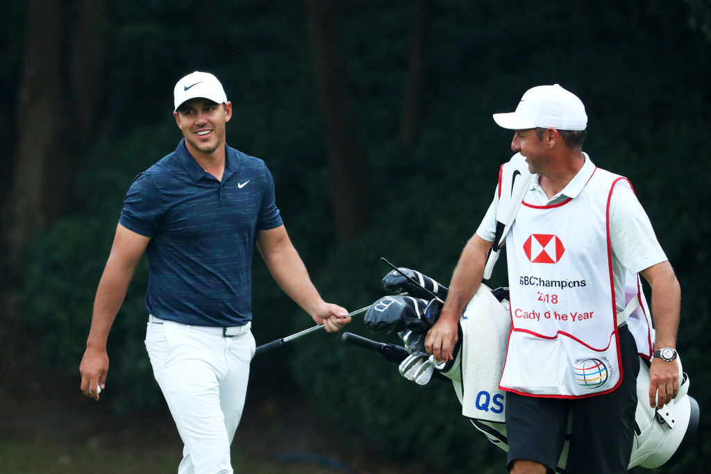 SHANGHAI, CHINA - OCTOBER 26:  Brooks Koepka of the United States, and 2018 Caddy of the Year, Ricky Elliott, react a chip in on the 15th hole during the second round of the WGC - HSBC Champions at Sheshan International Golf Club on October 26, 2018 in Shanghai, China.  (Photo by Matthew Lewis/Getty Images)