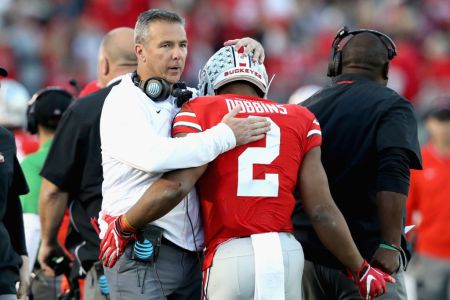 PASADENA, CA - JANUARY 01:  Ohio State Buckeyes head coach Urban Meyer and J.K. Dobbins #2 of the Ohio State Buckeyes celebrate a touchdown during the second half in the Rose Bowl Game presented by Northwestern Mutual at the Rose Bowl on January 1, 2019 in Pasadena, California.  (Photo by Sean M. Haffey/Getty Images)