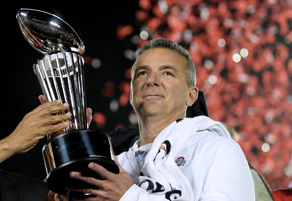 PASADENA, CA - JANUARY 01:  Ohio State Buckeyes head coach Urban Meyer with the Rose Bowl trophy celebrates winning the Rose Bowl Game presented by Northwestern Mutual at the Rose Bowl on January 1, 2019 in Pasadena, California.  (Photo by Harry How/Getty Images)