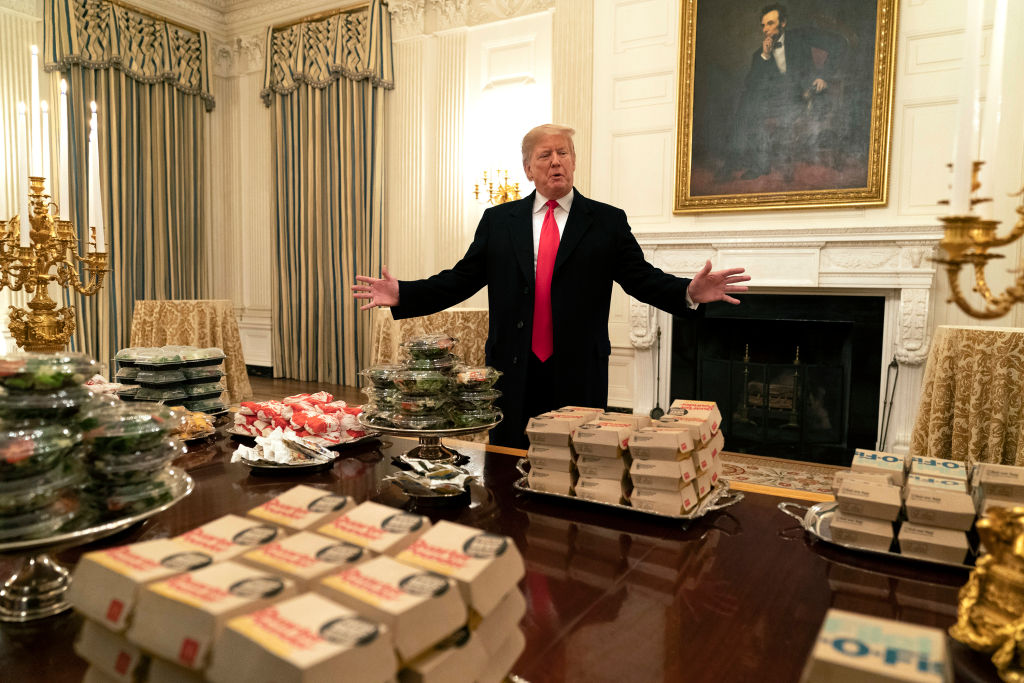WASHINGTON, DC - JANUARY 14: (AFP OUT) U.S President Donald Trump presents fast food to be served to the Clemson Tigers football team to celebrate their Championship at the White House on January 14, 2019 in Washington, DC. (Photo by Chris Kleponis-Pool/Getty Images)