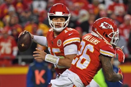 KANSAS CITY, MO - DECEMBER 30: Quarterback Patrick Mahomes #15 of the Kansas City Chiefs looks to throw a pass to the outside, after faking a handoff to running back Damien Williams #26 against the Oakland Raiders during the second half at Arrowhead Stadium on December 30, 2018 in Kansas City, Missouri. (Photo by Peter G. Aiken/Getty Images)