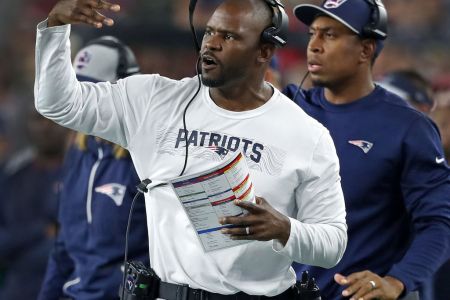 FOXBOROUGH, MA - OCTOBER 4: New England Patriots defensive signal caller Brian Flores gestures on the sidelines. The New England Patriots host the Indianapolis Colts in a regular season NFL football game at Gillette Stadium in Foxborough, MA on Oct. 4, 2018. (Photo by Jim Davis/The Boston Globe via Getty Images)