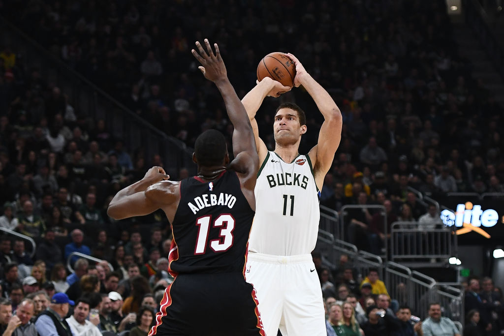 MILWAUKEE, WISCONSIN - JANUARY 15:  Brook Lopez #11 of the Milwaukee Bucks shoots over Bam Adebayo #13 of the Miami Heat during a game at Fiserv Forum on January 15, 2019 in Milwaukee, Wisconsin. (Photo by Stacy Revere/Getty Images)