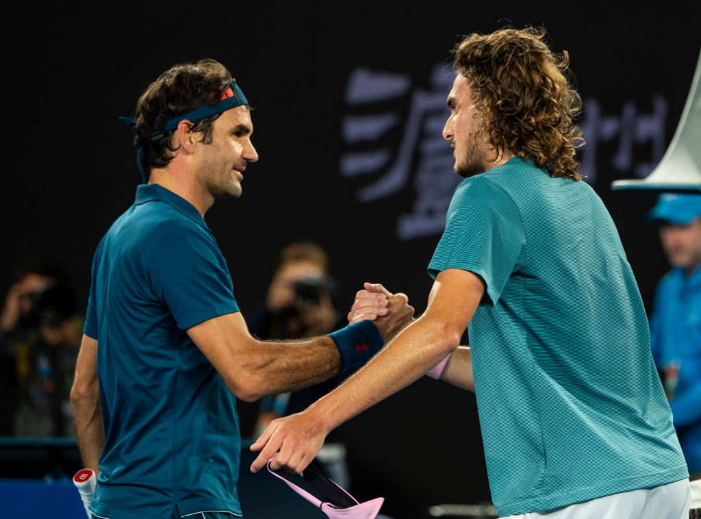Stefanos Tsitsipas (right) of Greece shakes hands with Roger Federer of Switzerland after beating him in the fourth round of the 2019 Australian Open on January 20, 2019. (Photo by TPN/Getty Images)
