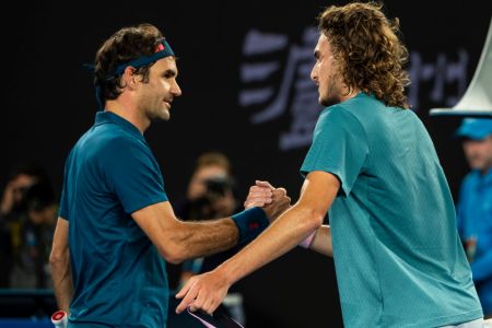 Stefanos Tsitsipas (right) of Greece shakes hands with Roger Federer of Switzerland after beating him in the fourth round of the 2019 Australian Open on January 20, 2019. (Photo by TPN/Getty Images)