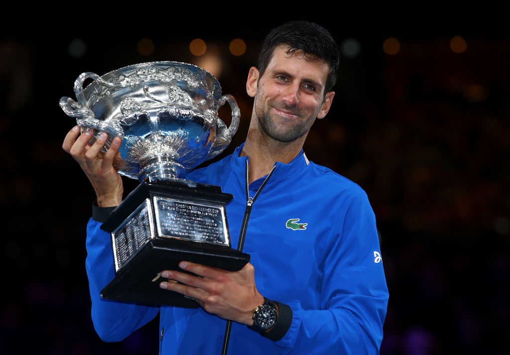 Novak Djokovic of Serbia poses with the Norman Brookes Challenge Cup following victory in his Men's Singles Final match against Rafael Nadal of Spain during day 14 of the 2019 Australian Open at Melbourne Park on January 27, 2019 in Melbourne, Australia. (Photo by Julian Finney/Getty Images)