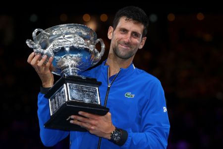 Novak Djokovic of Serbia poses with the Norman Brookes Challenge Cup following victory in his Men's Singles Final match against Rafael Nadal of Spain during day 14 of the 2019 Australian Open at Melbourne Park on January 27, 2019 in Melbourne, Australia. (Photo by Julian Finney/Getty Images)