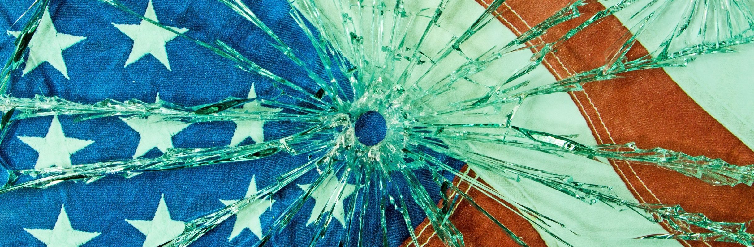 A safety glass with a bullet hole through the glass. (Getty Images)