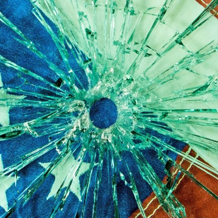 A safety glass with a bullet hole through the glass. (Getty Images)