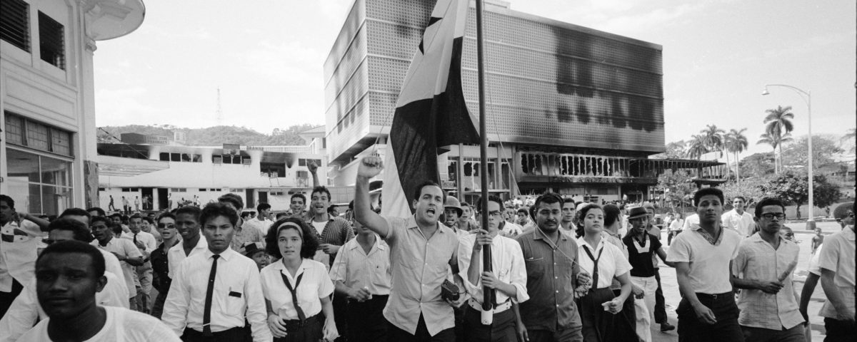 Panamanians march in protest near the Presidential Palace during riots over the sovereignity of Panama Canal Zone, Panama, 1964. (Photo by Michael Rougier/The LIFE Picture Collection/Getty Images)