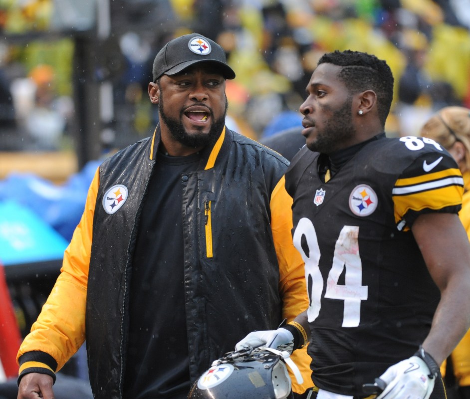 PITTSBURGH, PA - DECEMBER 29:  Head coach Mike Tomlin of the Pittsburgh Steelers talks to wide receiver Antonio Brown #84 as they walk off the field at the end of the first half during a game against the Cleveland Browns at Heinz Field on December 29, 2013 in Pittsburgh, Pennsylvania.  The Steelers defeated the Browns 20-7.  (Photo by George Gojkovich/Getty Images)