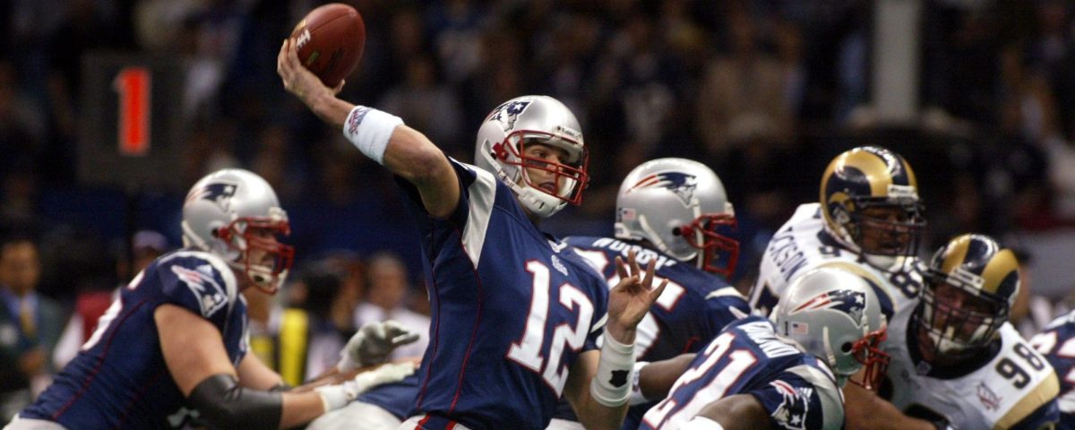Patriots' Tom Brady throws a touchdown pass in the second quarter. New England Patriots face the St. Louis Rams in Super Bowl XXXVI at the Louisiana Superdome in New Orleans, LA on Feb. 3, 2002. (Photo by Bill Greene/The Boston Globe via Getty Images)