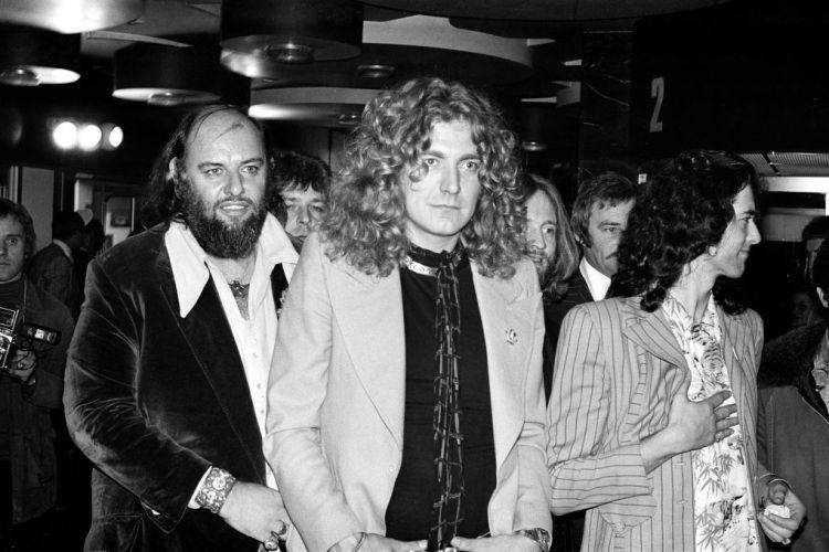 Rock band Led Zeppelin at the UK premier of the concert film 'The Song Remains The Same'. Pictured from left to right, manager Peter Grant, Robert Plant and Jimmy Page, 4th November 1976. (Photo by G Morris/Mirrorpix/Getty Images)
