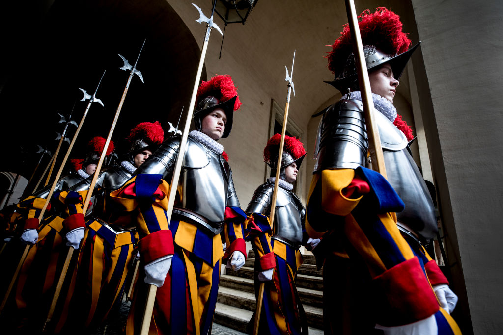 33 new Vatican Swiss Guards recruits prepare to be sworn in during a ceremony at St. Damaso courtyard on May 6, 2018 in Vatican City, Vatican. The annual swearing in ceremony for the New Papal Swiss Guards takes place every year on May 6, commemorating the 147 soldiers who died defending Pope Clement VII on the same day in 1527 during the sack of Rome. (Photo by Alessandra Benedetti - Corbis/Corbis via Getty Images)