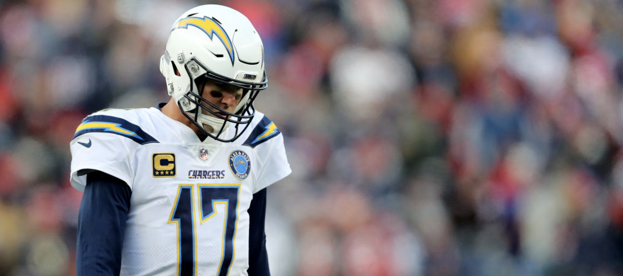 FOXBOROUGH, MASSACHUSETTS - JANUARY 13: Philip Rivers #17 of the Los Angeles Chargers reacts during the third quarter in the AFC Divisional Playoff Game against the New England Patriots at Gillette Stadium on January 13, 2019 in Foxborough, Massachusetts. (Photo by Elsa/Getty Images)