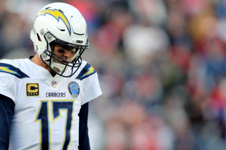 FOXBOROUGH, MASSACHUSETTS - JANUARY 13: Philip Rivers #17 of the Los Angeles Chargers reacts during the third quarter in the AFC Divisional Playoff Game against the New England Patriots at Gillette Stadium on January 13, 2019 in Foxborough, Massachusetts. (Photo by Elsa/Getty Images)
