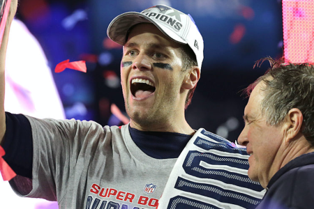 Patriots quarterback Tom Brady and coach Bill Belichick pose with the trophy at the post-game ceremony and celebration after the Patriots won Super Bowl XLIX. (Photo by Barry Chin/The Boston Globe via Getty Images)