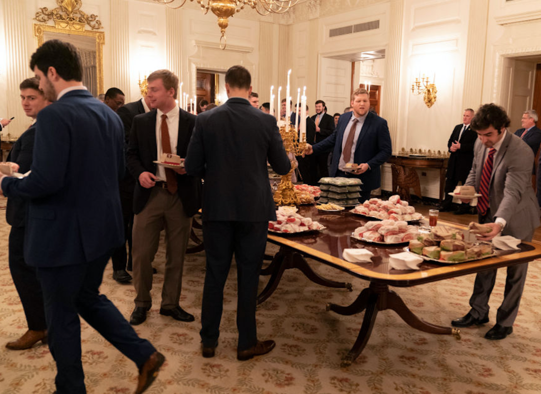 WASHINGTON, DC - JANUARY 14: (AFP OUT) Members of the Clemson Tigers football team prepare to dine on fast food served by President Trump to celebrate their Championship at the White House on January 14, 2019 in Washington, DC. (Photo by Chris Kleponis-Pool/Getty Images)