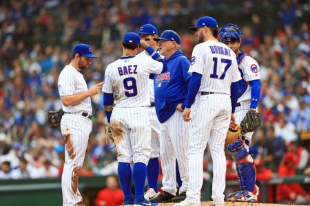 CHICAGO, IL - SEPTEMBER 30: Manager Joe Maddon #70 of the Chicago Cubs talks at the mound with his infield during the third inning against the St. Louis Cardinals at Wrigley Field on September 30, 2018 in Chicago, Illinois. (Photo by Andrew Weber/Getty Images)