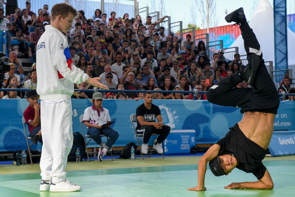 Japan's b-boy Shigelix (R) competes against Russia's b-boy Bumblebee during a battle at the Youth Olympic Games in Buenos Aires, Argentina on October 08, 2018. - The Youth Olympic Games in Buenos Aires hosted the world's best youth break dancers to compete for the first ever Olympic medal in the athletic art. (Photo by EITAN ABRAMOVICH / AFP/Getty Images)