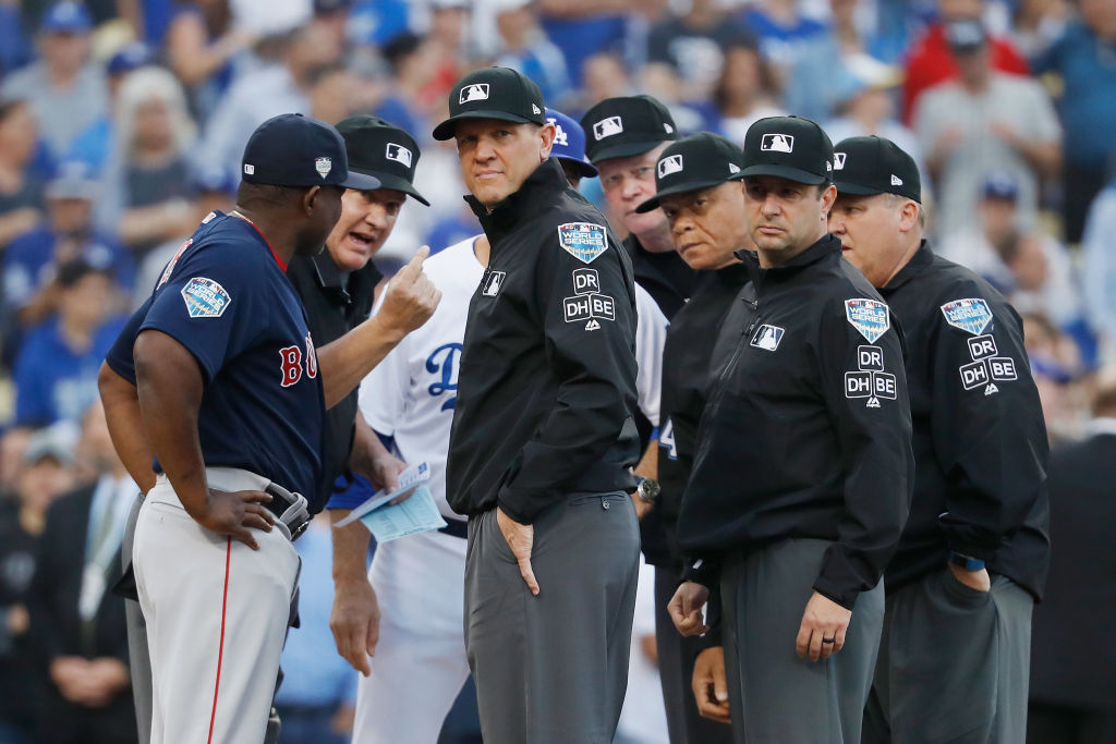 LOS ANGELES, CA - OCTOBER 28:  The umpires meet  prior to Game Five of the 2018 World Series between the Los Angeles Dodgers and the Boston Red Sox at Dodger Stadium on October 28, 2018 in Los Angeles, California.  (Photo by Sean M. Haffey/Getty Images)