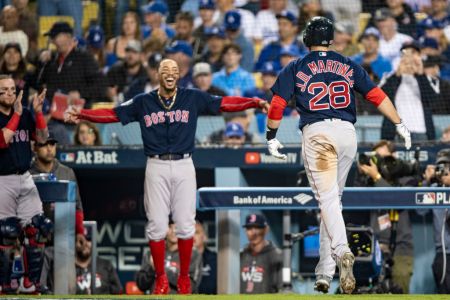 LOS ANGELES, CA - OCTOBER 28: J.D. Martinez #28 of the Boston Red Sox reacts with Mookie Betts #50 after hitting a solo home run during the seventh inning of game five of the 2018 World Series against the Los Angeles Dodgers on October 28, 2018 at Dodger Stadium in Los Angeles, California. (Photo by Billie Weiss/Boston Red Sox/Getty Images)