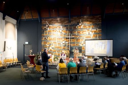 Hayarpi Tamrazyan (C) from Armenia attends a service in the Bethel church in The Hague, eastern Netherlands, on December 6, 2018, as the church is holding round-the-clock religious services to prevent the family from being deported. - The Bethel Church in The Hague, Netherlands, has taken advantage of a loophole in Dutch law which says that police cannot enter the premises while a religious service is underway. The five members of the Tamrazyan family, who have been living in the Netherlands for nine years, took refuge in the church on October 25, 2018 after Dutch authorities turned down their request for asylum. (Photo by Koen van Weel / ANP / AFP) / Netherlands OUT        (Photo credit should read KOEN VAN WEEL/AFP/Getty Images)