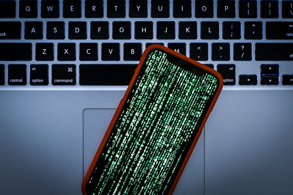 Matrix style graphics are seen on an Apple iPhone in this photo illustration on January 22, 2019. (Photo by Jaap Arriens/NurPhoto via Getty Images)