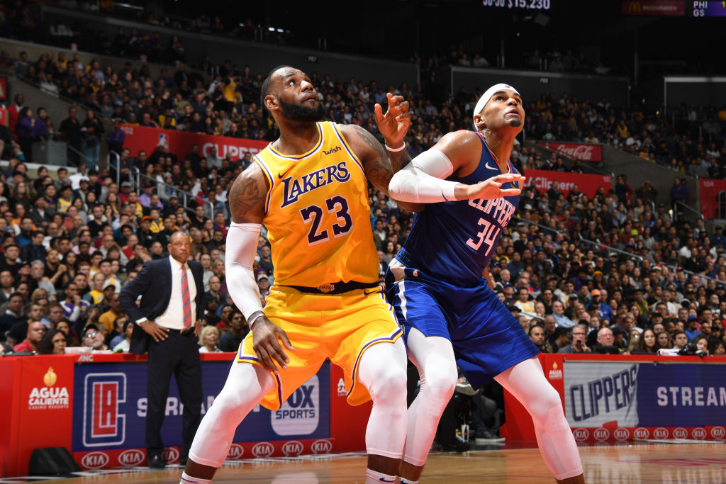 LOS ANGELES, CA - JANUARY 31: LeBron James #23 of the Los Angeles Lakers and Tobias Harris #34 of the LA Clippers look to grab the rebound on January 31, 2019 at STAPLES Center in Los Angeles, California. (Photo by Andrew D. Bernstein/NBAE via Getty Images)